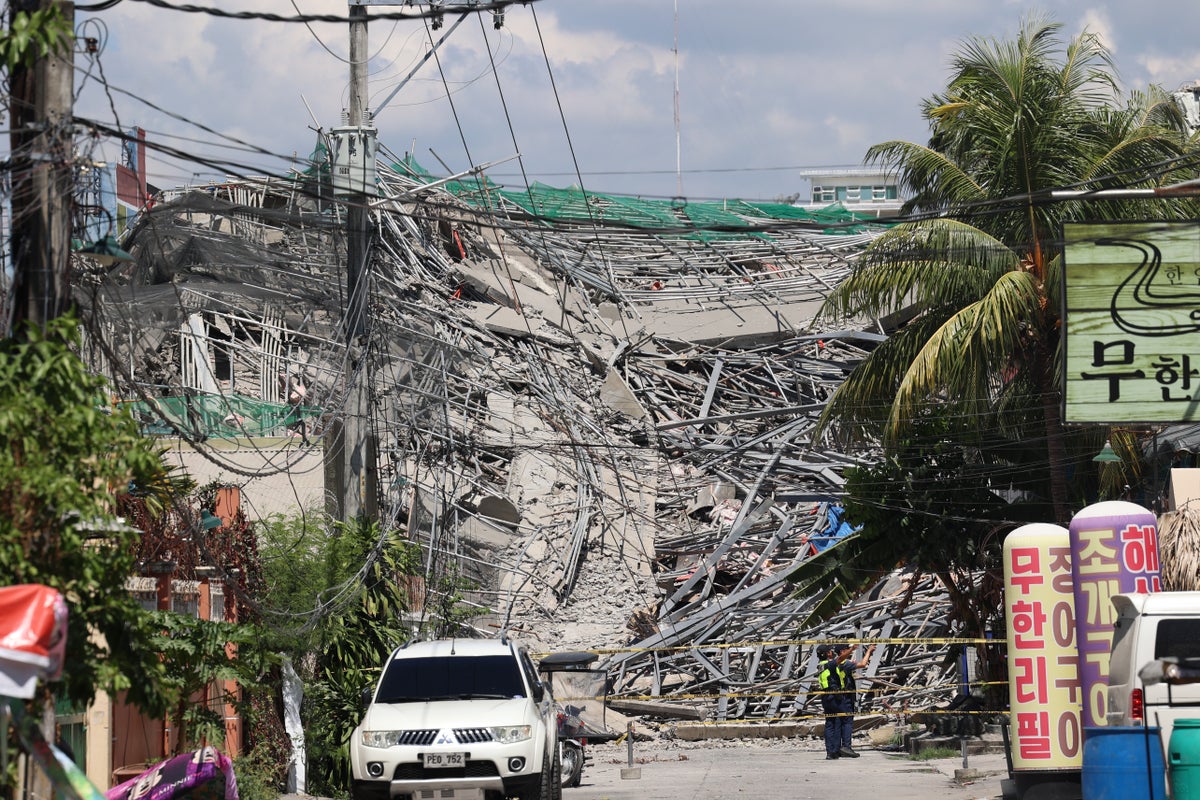 A 9-story building under construction in Philippines collapses, possibly trapping dozens of workers
